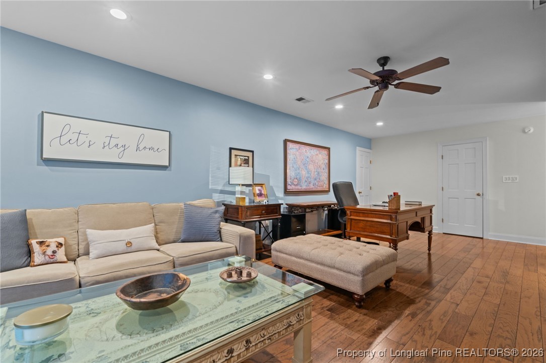 30181 East Lake Road Wagram, NC 28396 - Photo 36 of 38 a living room with furniture and a wooden floor