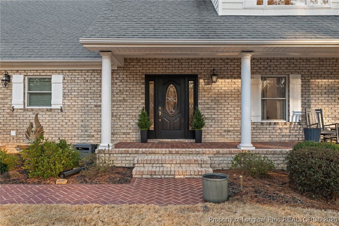 30181 East Lake Road Wagram, NC 28396 - Photo 6 of 38 a front view of a house