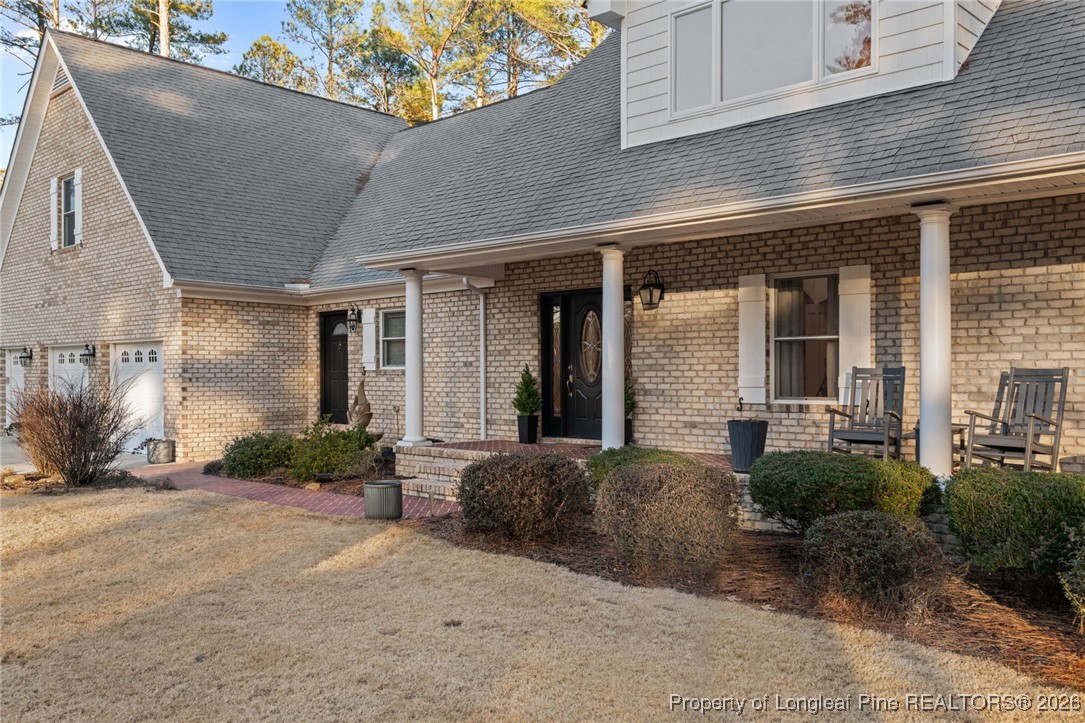 30181 East Lake Road Wagram, NC 28396 - Photo 7 of 38 a view of a house with a patio