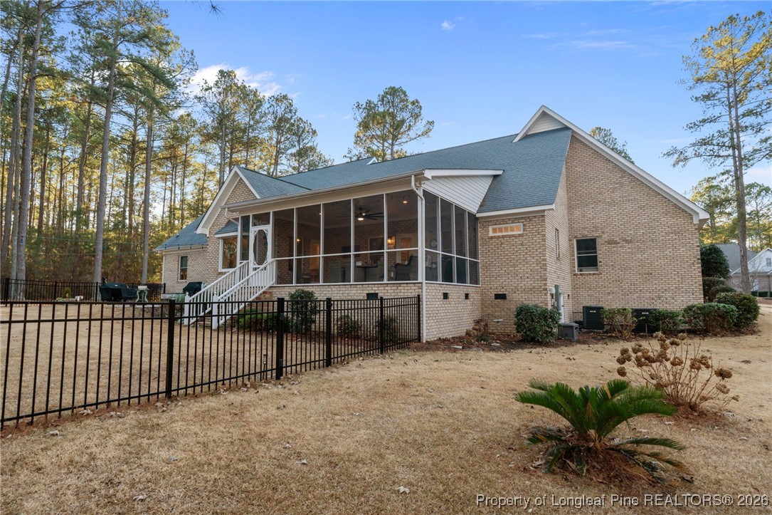 30181 East Lake Road Wagram, NC 28396 - Photo 10 of 38 a front view of a house with a garden