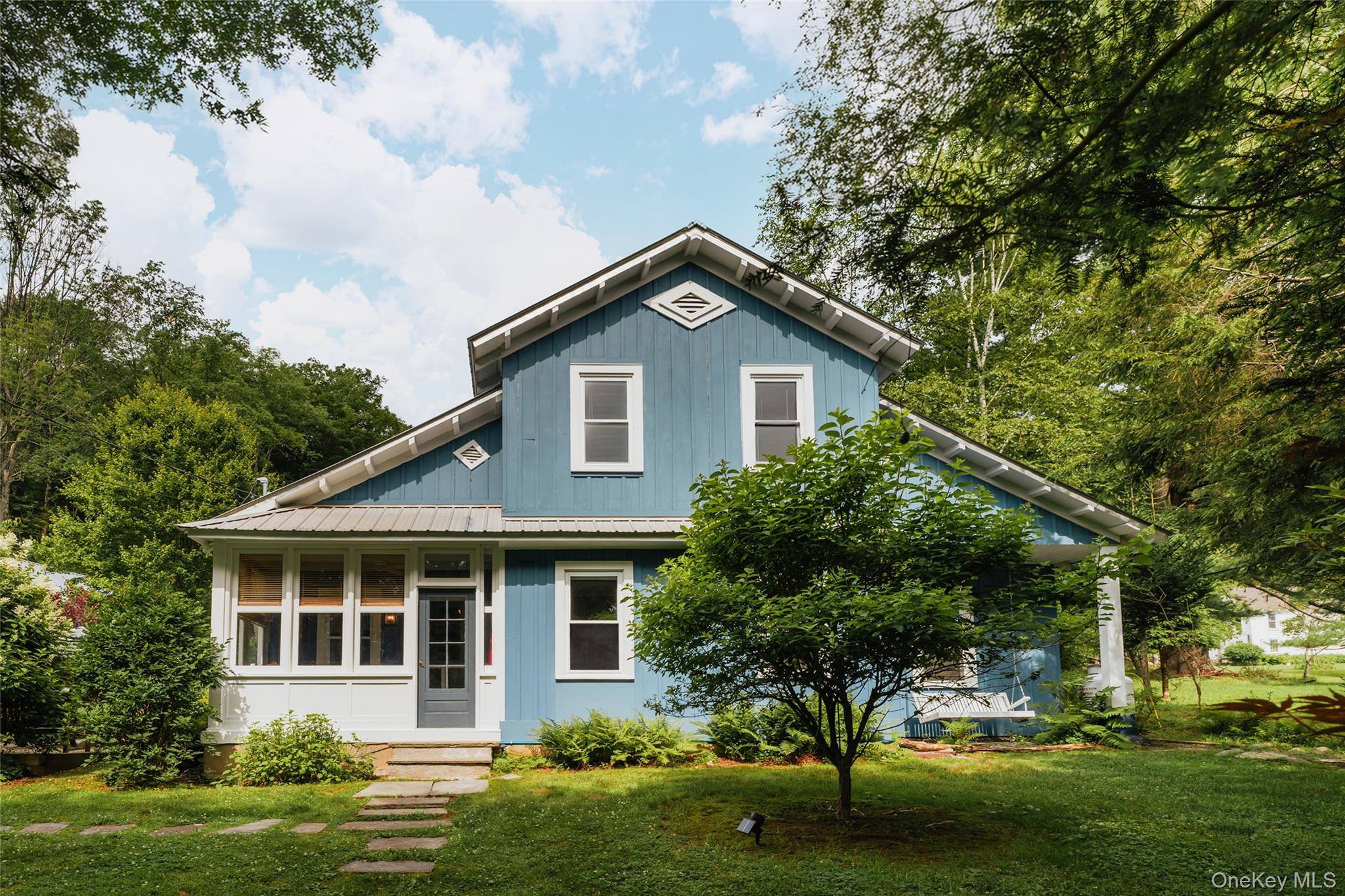 1680 Gulf Road North Branch, NY 12766 - Photo 2 of 46 a front view of a house with a garden and trees