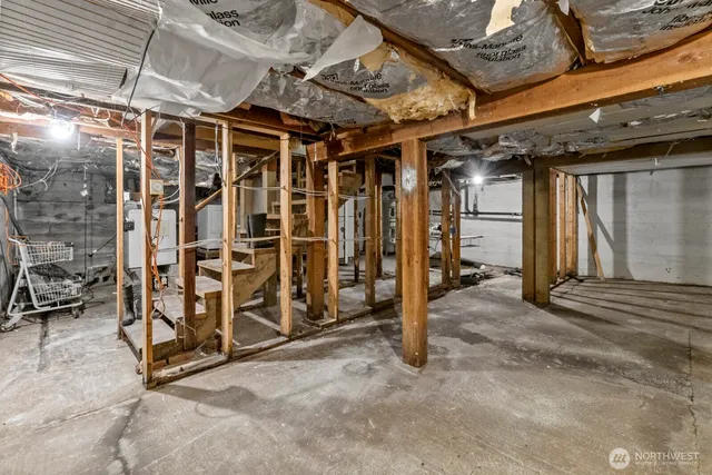 a view of an empty room with wooden walls