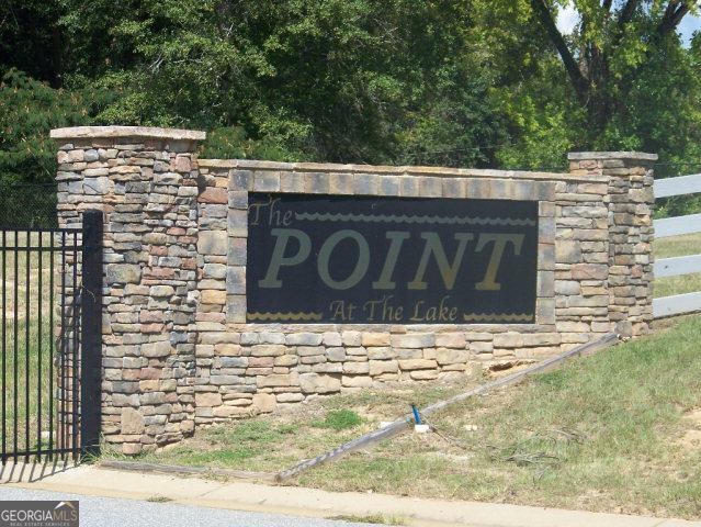 0 Point Drive, Unit LOT 2 3 4 Georgetown, GA 39854 - Photo 2 of 9 a sign that is on the side of a building