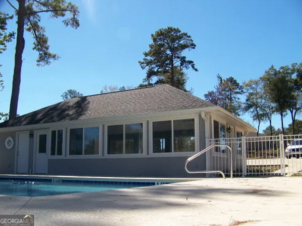a view of a house next to a yard