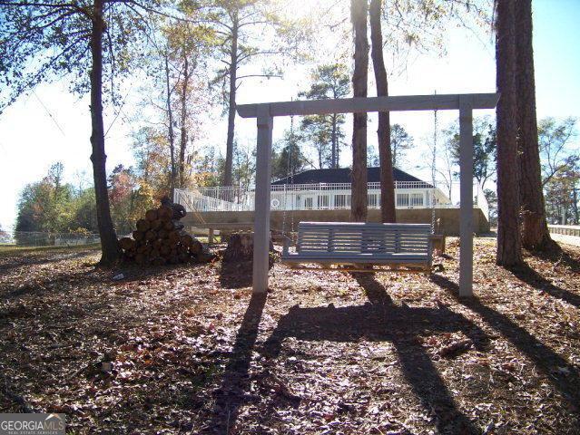 0 Point Drive, Unit LOT 2 3 4 Georgetown, GA 39854 - Photo 9 of 9 a view of a porch with a yard