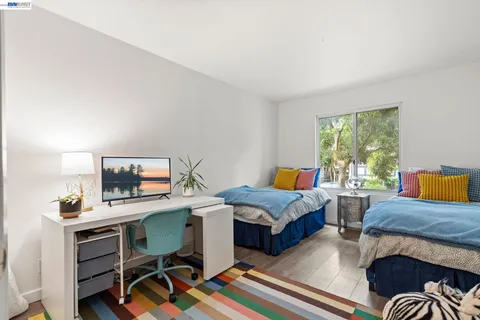 a view of washer and dryer with kitchen in the background