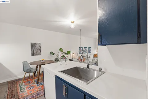 a living room with furniture and a book shelf