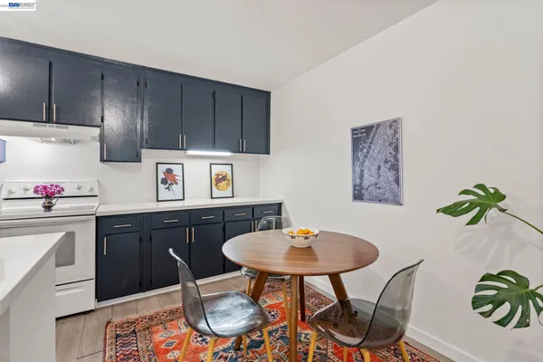 a living room with furniture kitchen view and a table