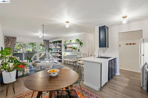 a living room with furniture and a book shelf