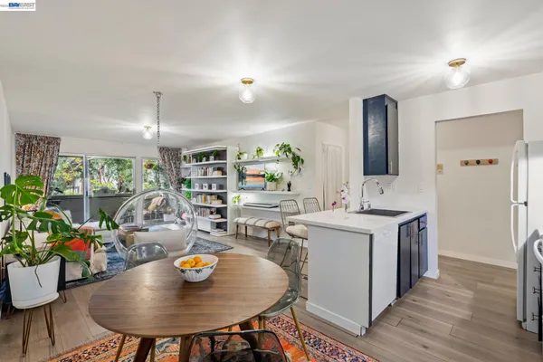 a living room with furniture and a book shelf