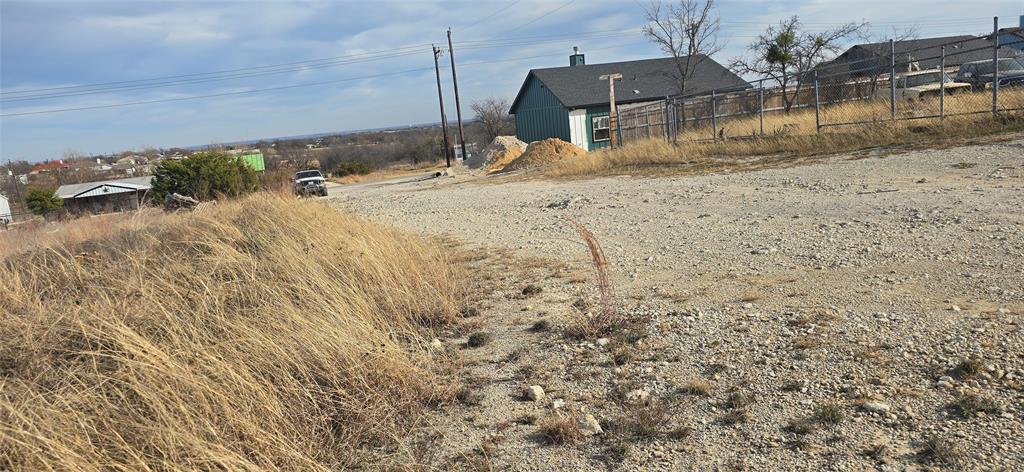 108 Sparrow Drive Azle, TX 76020 - Photo 3 of 9 a swimming pool with a yard