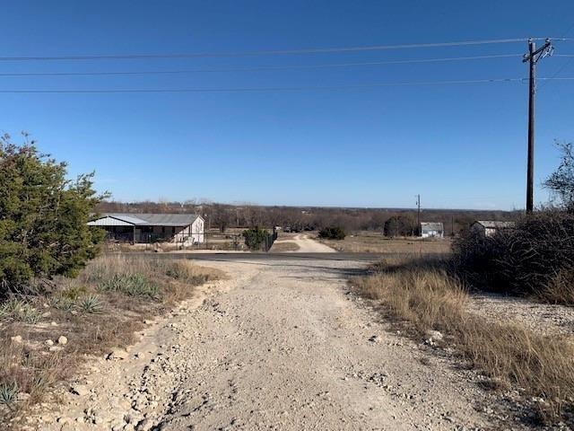 108 Sparrow Drive Azle, TX 76020 - Photo 7 of 9 a view of a dry yard with wooden fence