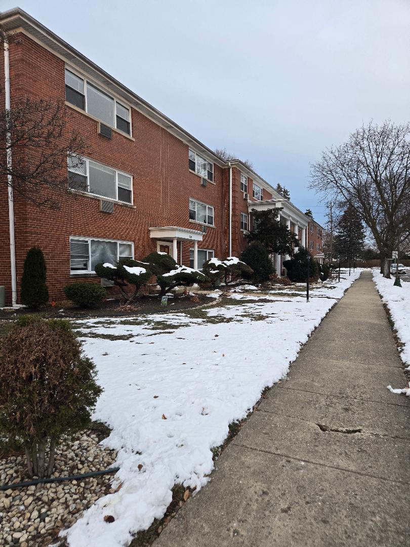570 Princeton Street, Unit D2W Des Plaines, IL 60016 - Photo 2 of 10 a street view with residential house