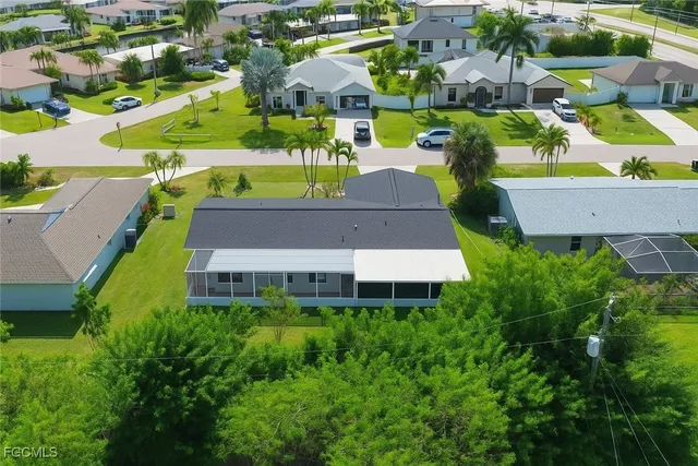 an aerial view of a house with a swimming pool