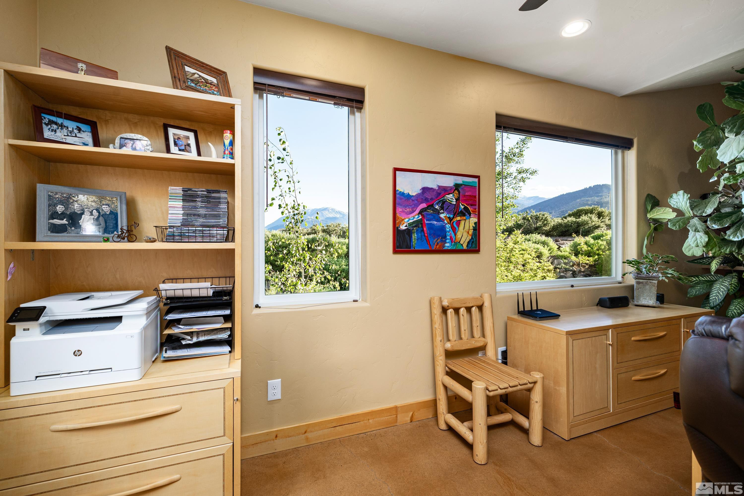 5745 Carl Drive Reno, NV 89511 - Photo 17 of 40 a living room with furniture and a bookshelf