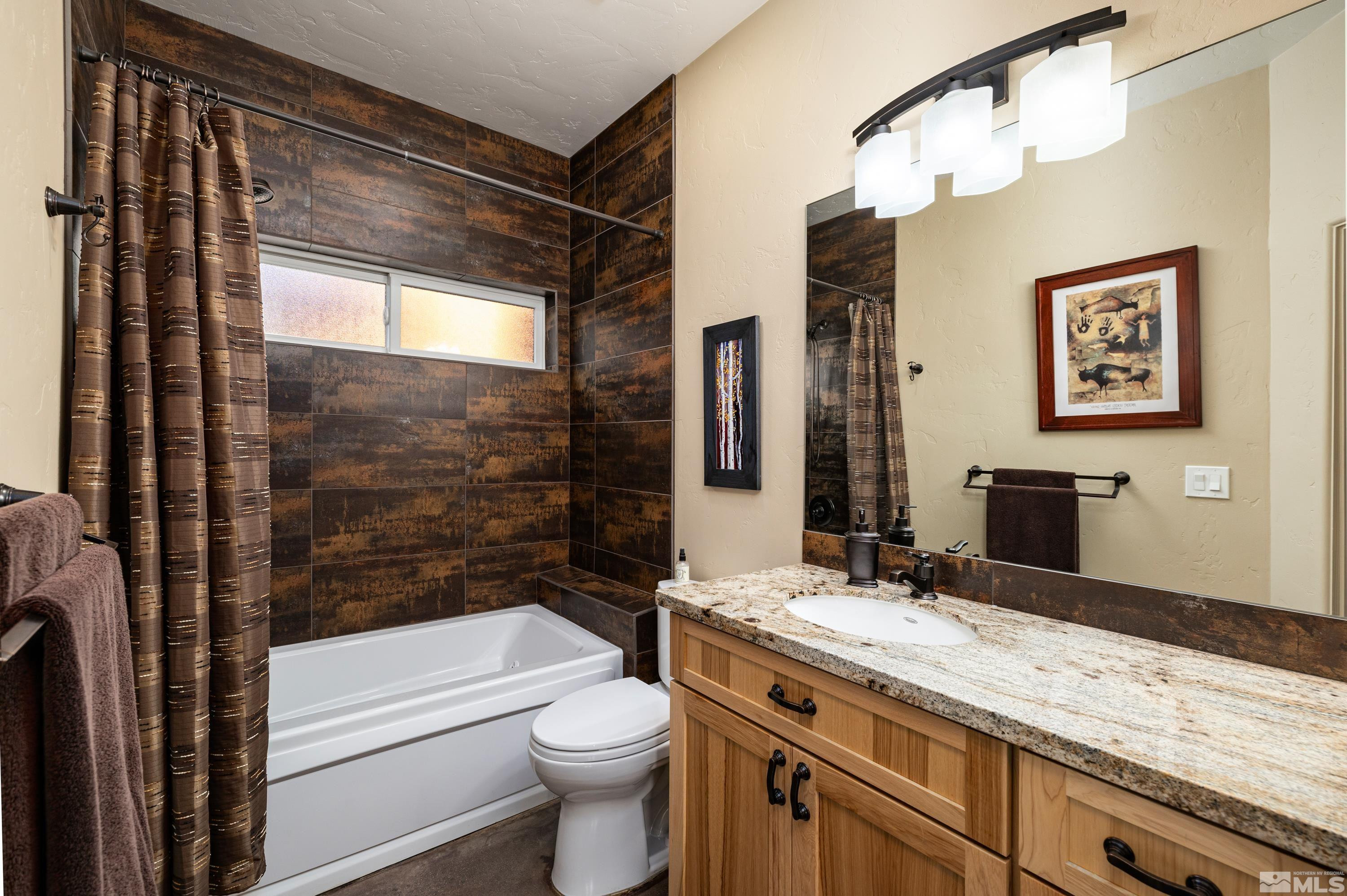 5745 Carl Drive Reno, NV 89511 - Photo 18 of 40 a bathroom with a granite countertop sink toilet and shower