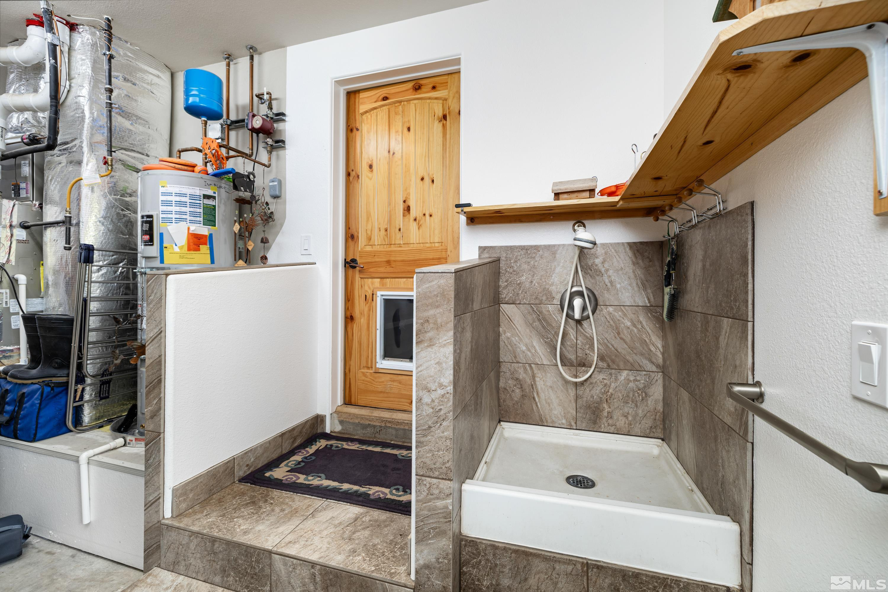 5745 Carl Drive Reno, NV 89511 - Photo 21 of 40 a bathroom with a tub and a shower