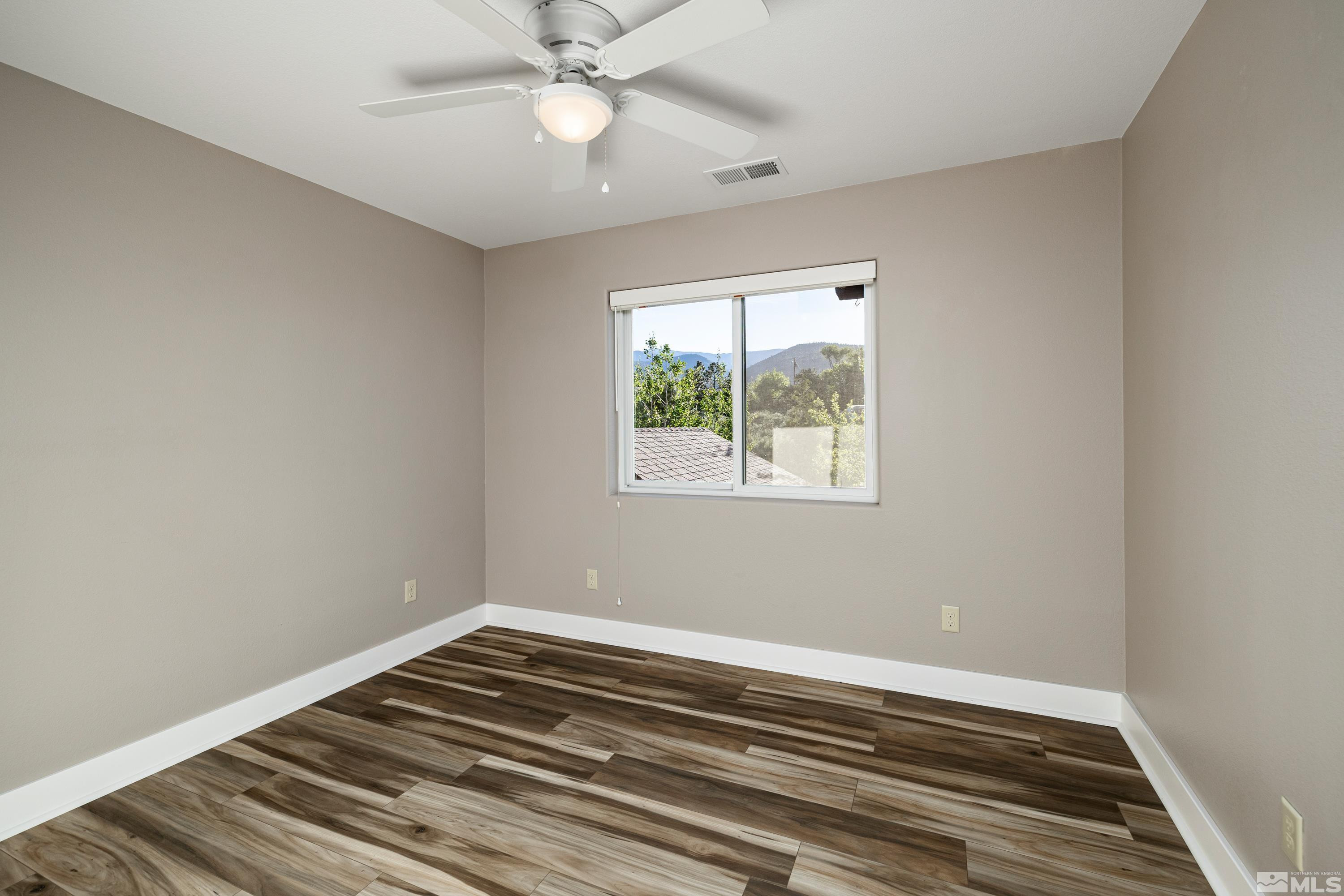 5745 Carl Drive Reno, NV 89511 - Photo 28 of 40 a view of a room with wooden floor and window