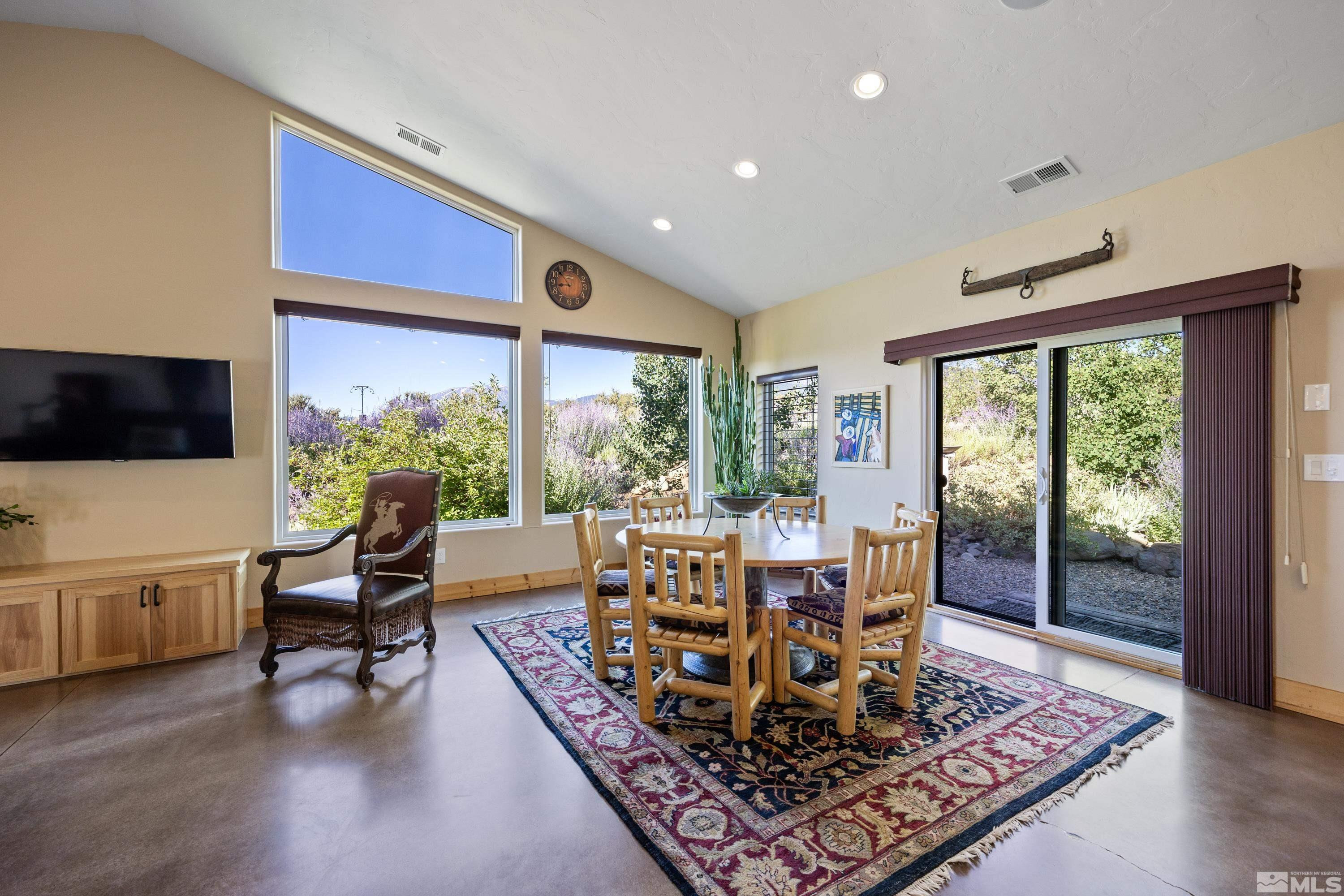 5745 Carl Drive Reno, NV 89511 - Photo 5 of 40 a living room with furniture and a large window