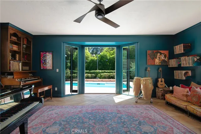 a view of game room with window and fireplace