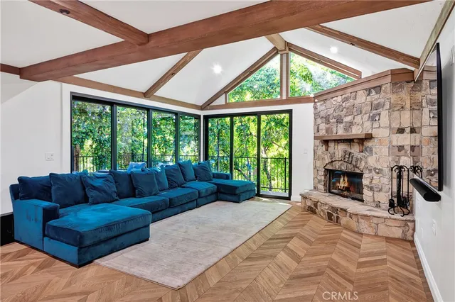 a living room with fireplace furniture and a flat screen tv
