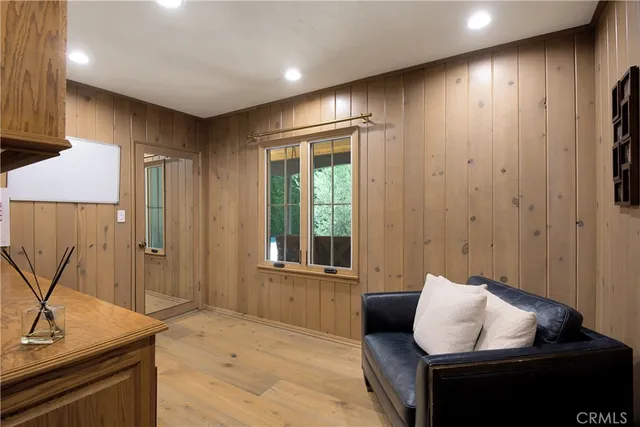 a bathroom with a double vanity sink large mirror and a bathtub