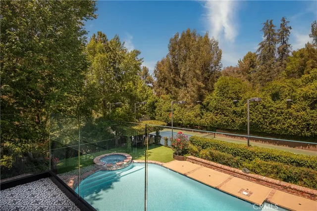 a view of hallway with furniture and a window