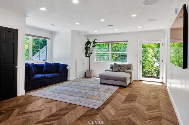 a view of a white house with a swimming pool