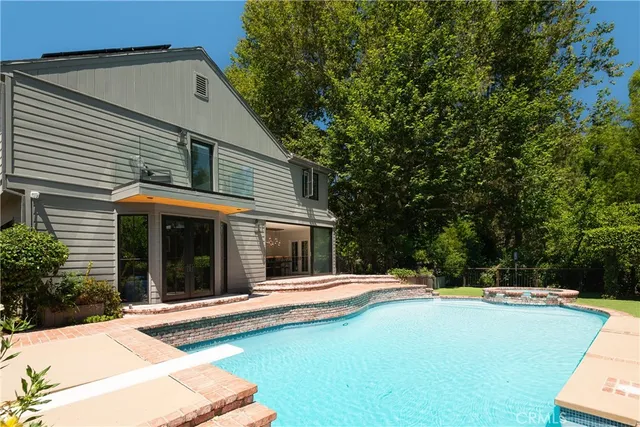 a view of swimming pool with seating space