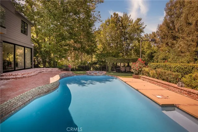 a view of a swimming pool with an outdoor space