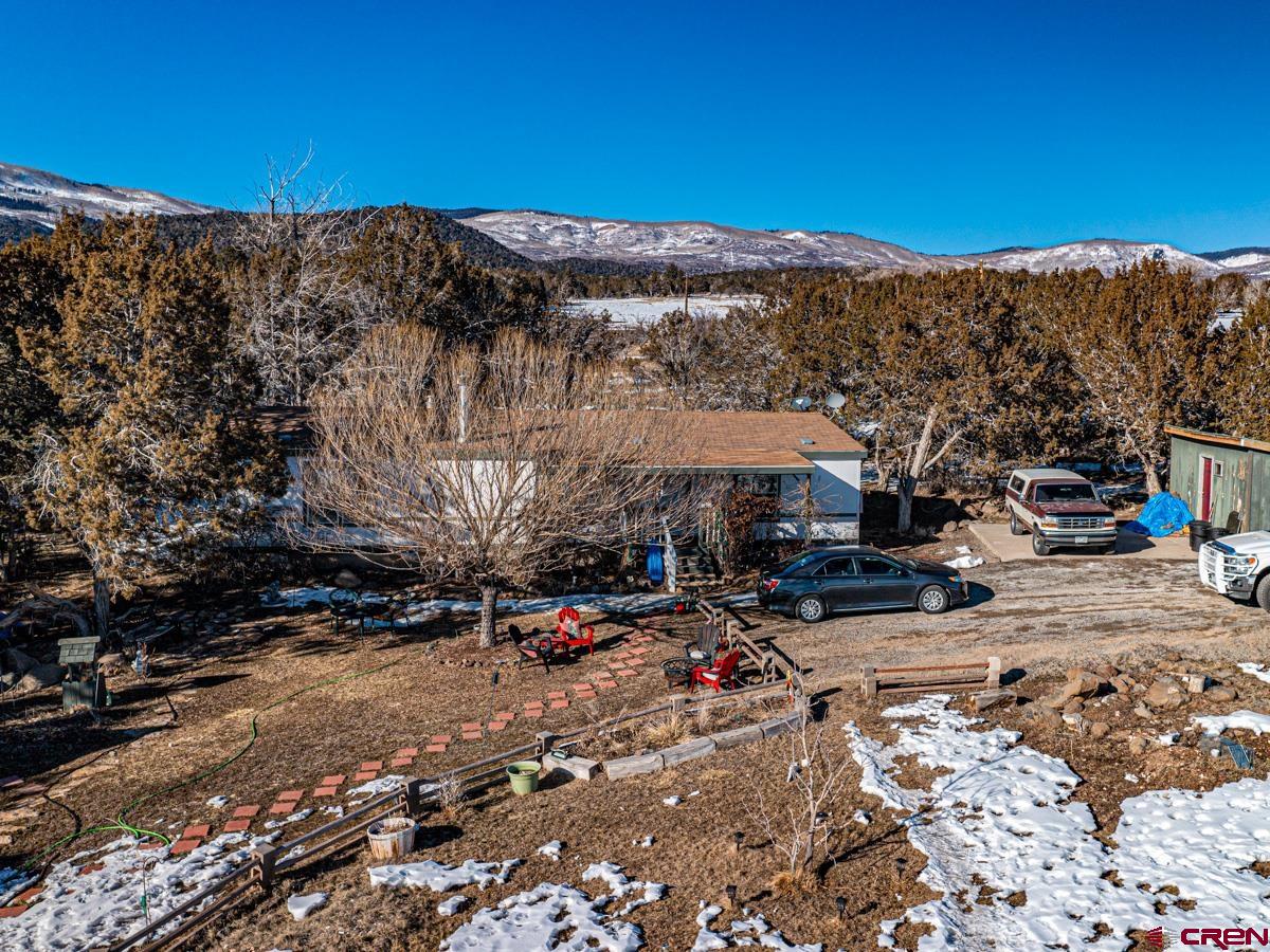 19987 Green Valley Road Cedaredge, CO 81413 - Photo 17 of 25 a view of a street with a building in the background