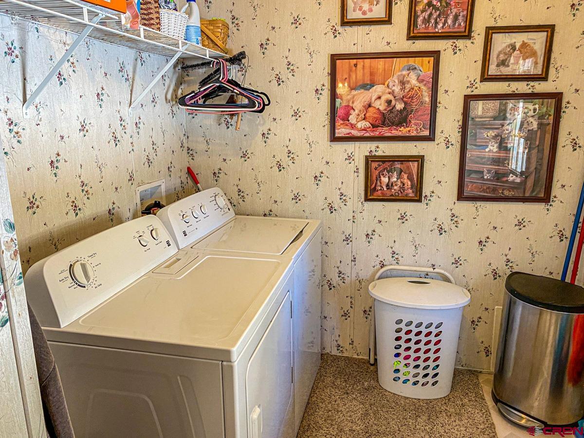 19987 Green Valley Road Cedaredge, CO 81413 - Photo 10 of 25 a utility room with dryer and washer