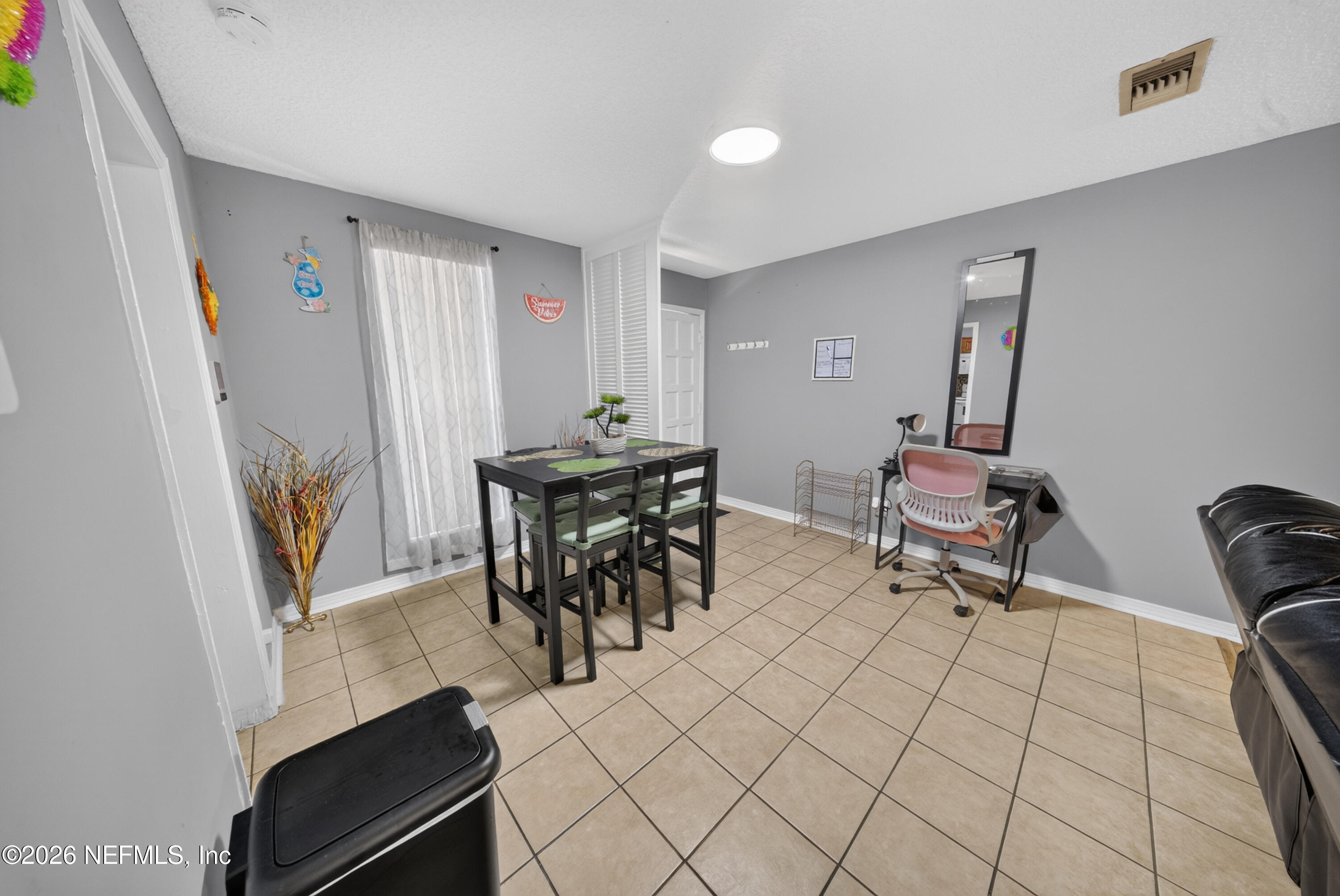 7346 El Barco Road, Unit 4 Jacksonville, FL 32216 - Photo 3 of 19 a view of a workspace with furniture and entryway