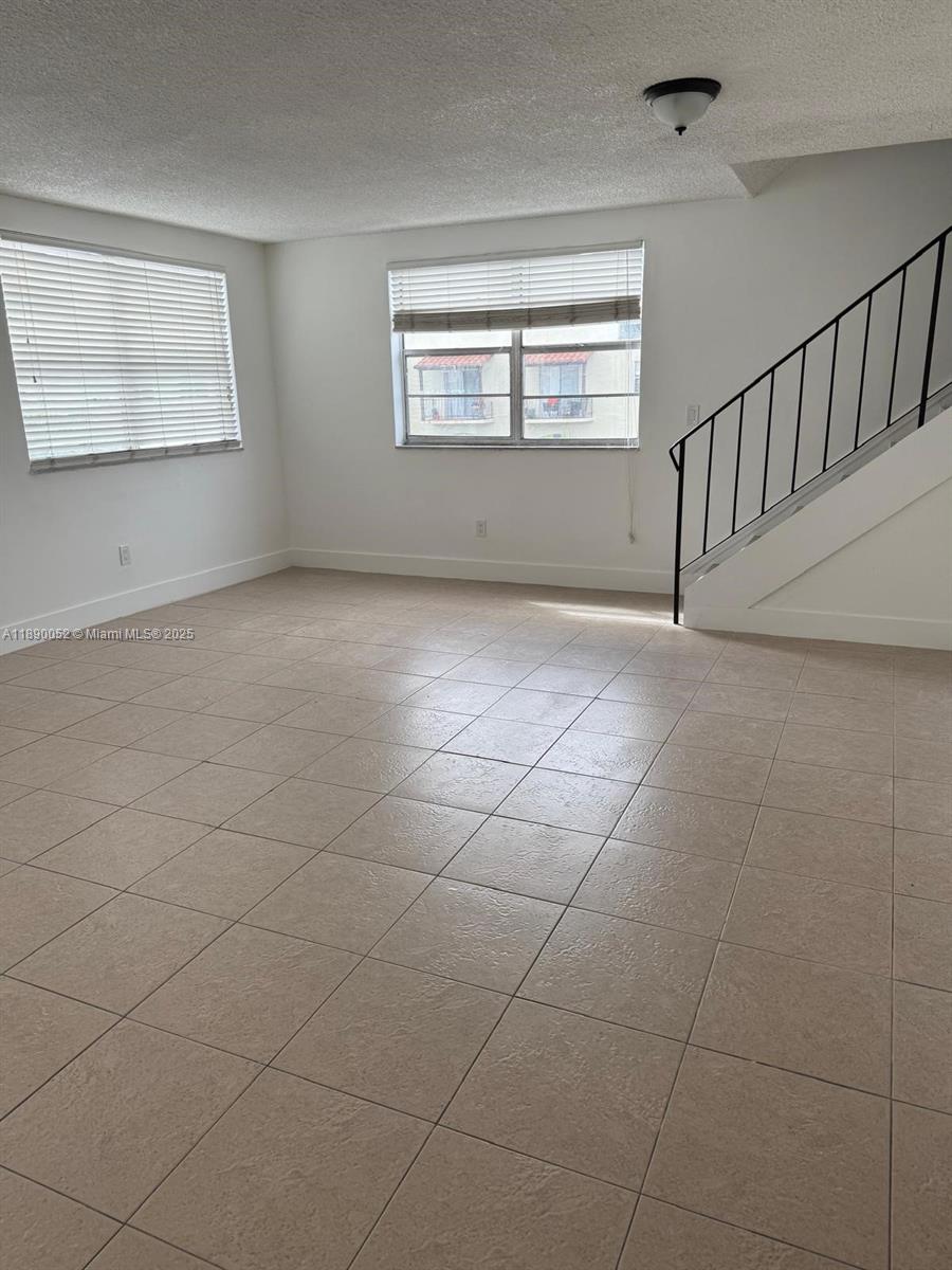 1255 West 53rd Street, Unit 202 Hialeah, FL 33012 - Photo 1 of 11 a view of an empty room and window