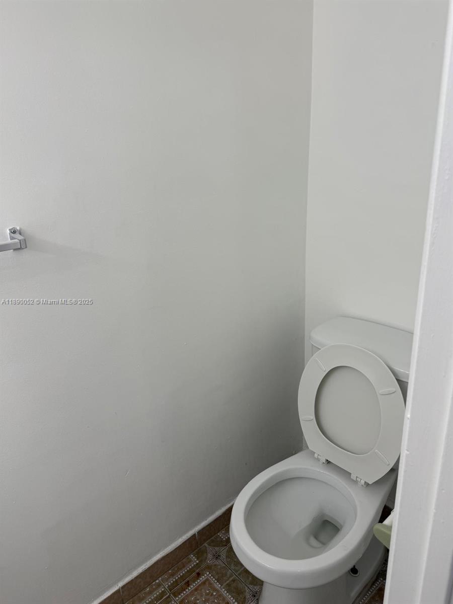 1255 West 53rd Street, Unit 202 Hialeah, FL 33012 - Photo 6 of 11 a bathroom with a toilet and sink