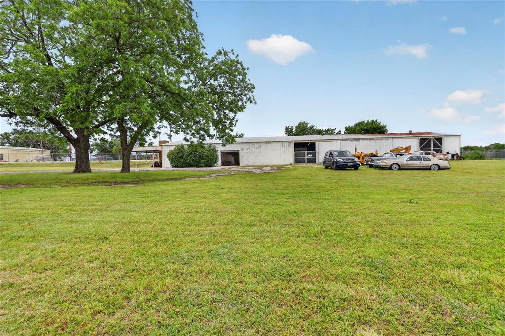 1092 West Highway 199 Springtown, TX 76082 - Photo 5 of 29 Metal building featuring multiple bays and a metal roof