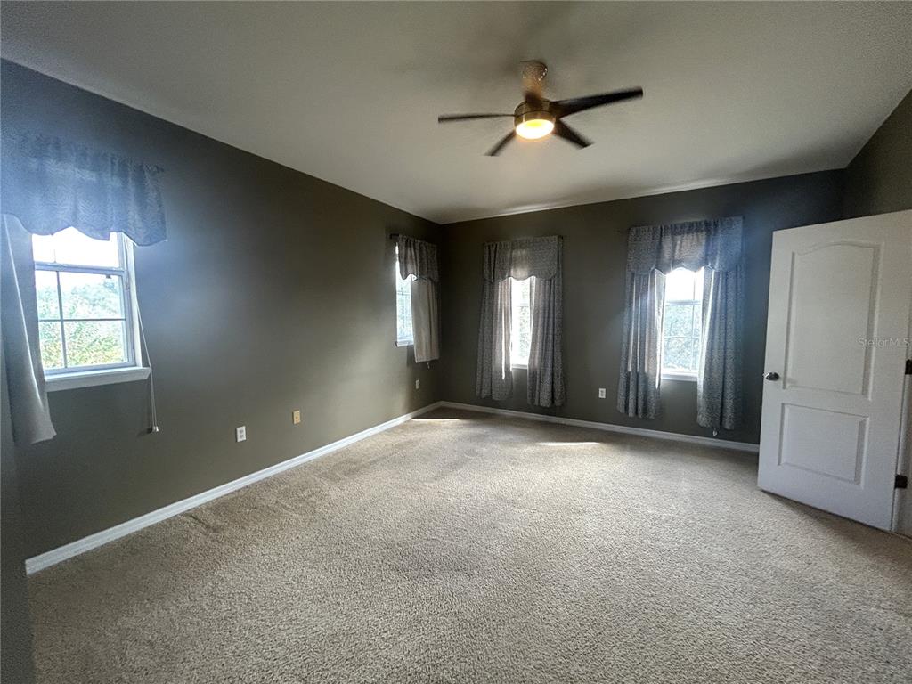 9036 Moonlit Meadows Loop Riverview, FL 33578 - Photo 11 of 20 a view of a livingroom with a ceiling fan and window