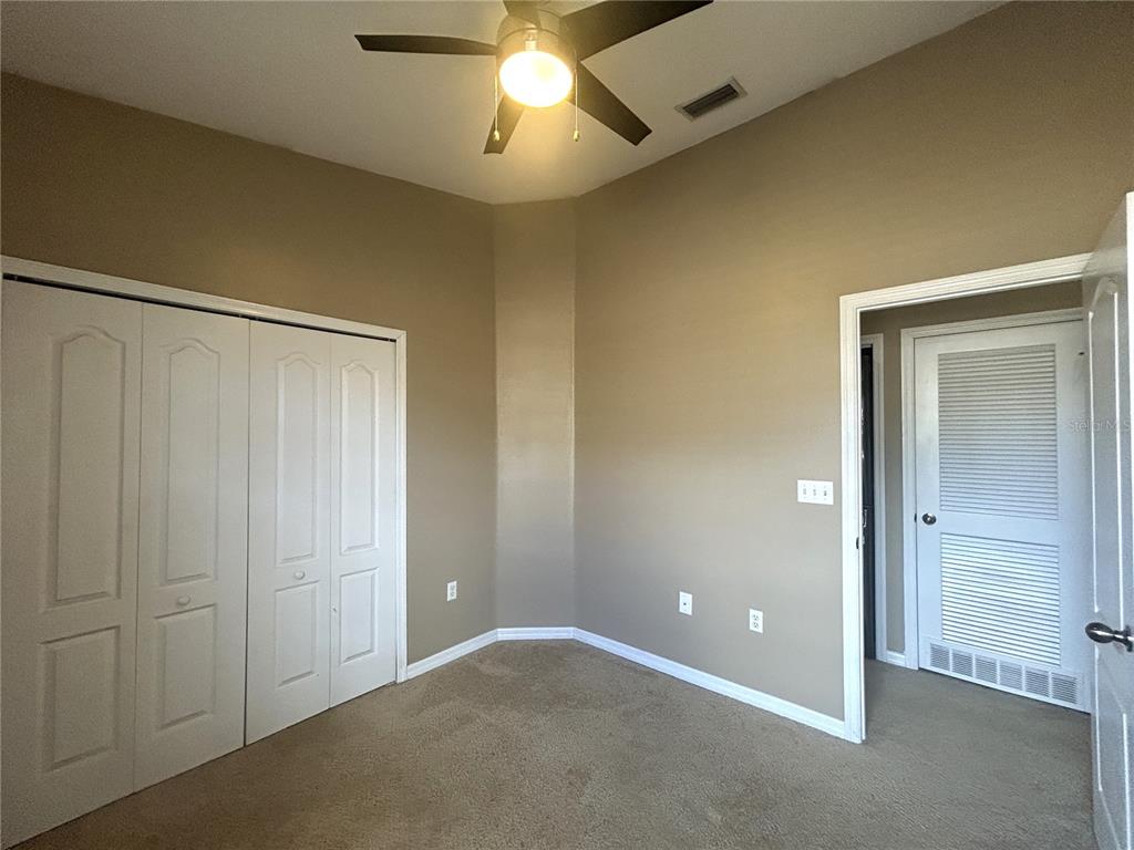 9036 Moonlit Meadows Loop Riverview, FL 33578 - Photo 14 of 20 an empty room with chandelier fan