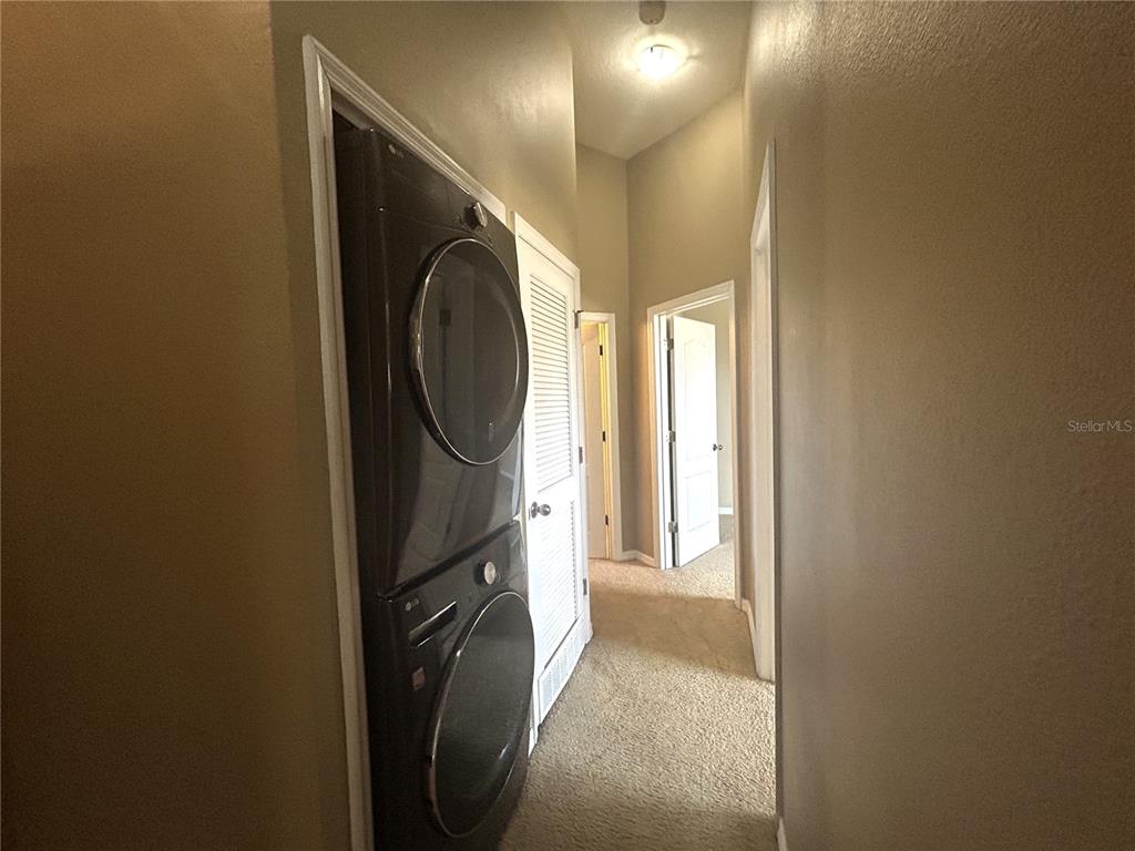 9036 Moonlit Meadows Loop Riverview, FL 33578 - Photo 20 of 20 a view of a hallway with washer and dryer