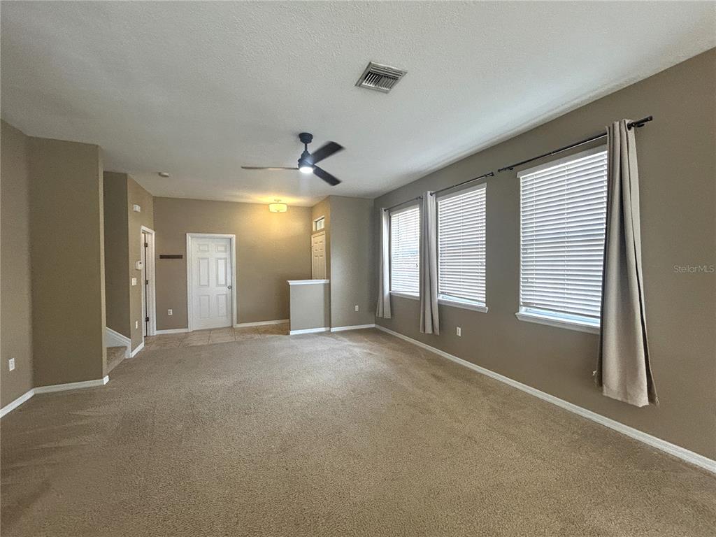 9036 Moonlit Meadows Loop Riverview, FL 33578 - Photo 7 of 20 a view of an empty room with a window