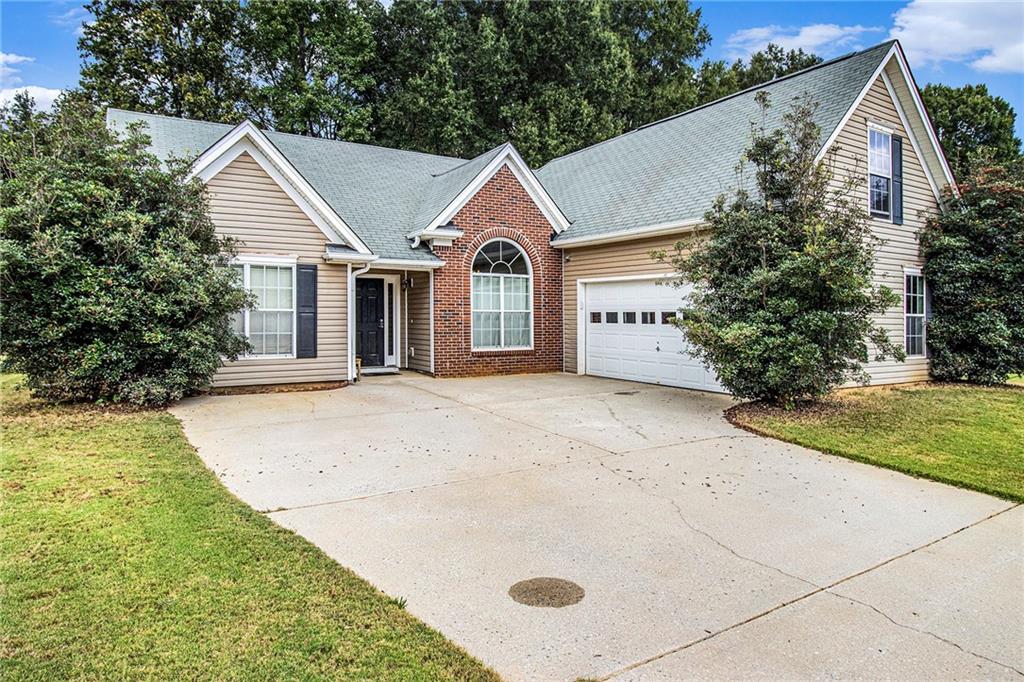 260 Sandstone Drive Hampton, GA 30228 - Photo 3 of 8 a view of a house with backyard and garden