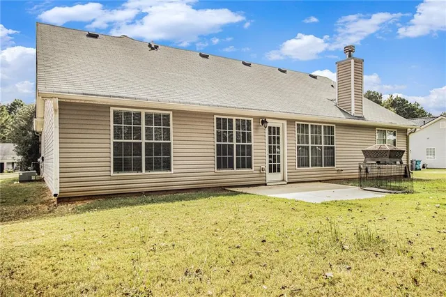 a house with swimming pool in front of it