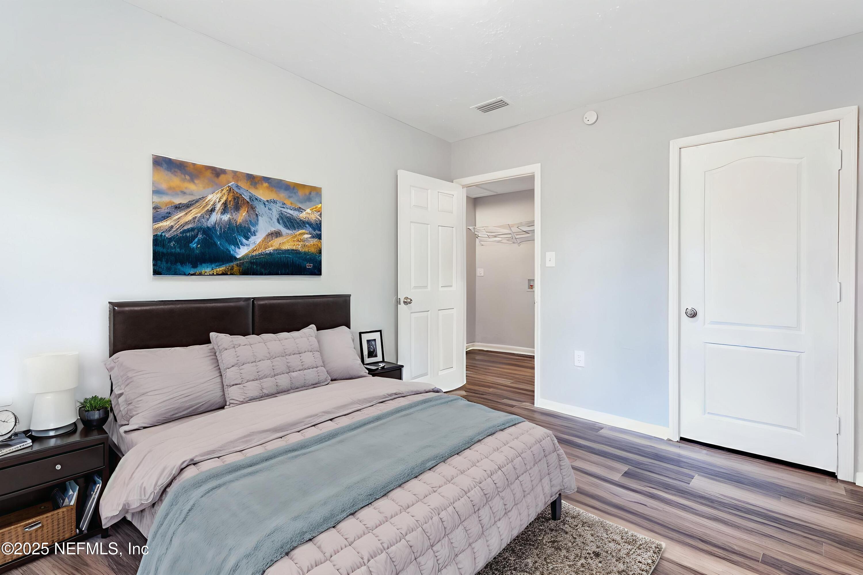 1165 Hart Street Jacksonville, FL 32209 - Photo 12 of 22 a bedroom with bed and cupboard