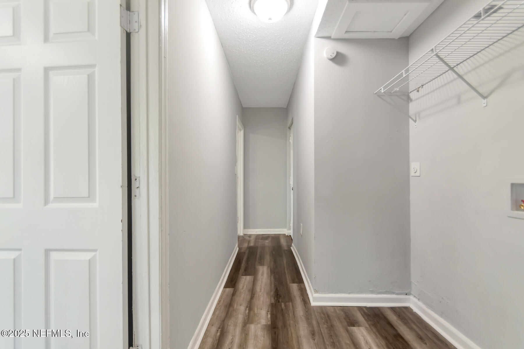 1165 Hart Street Jacksonville, FL 32209 - Photo 13 of 22 a view of walk in closet with empty racks