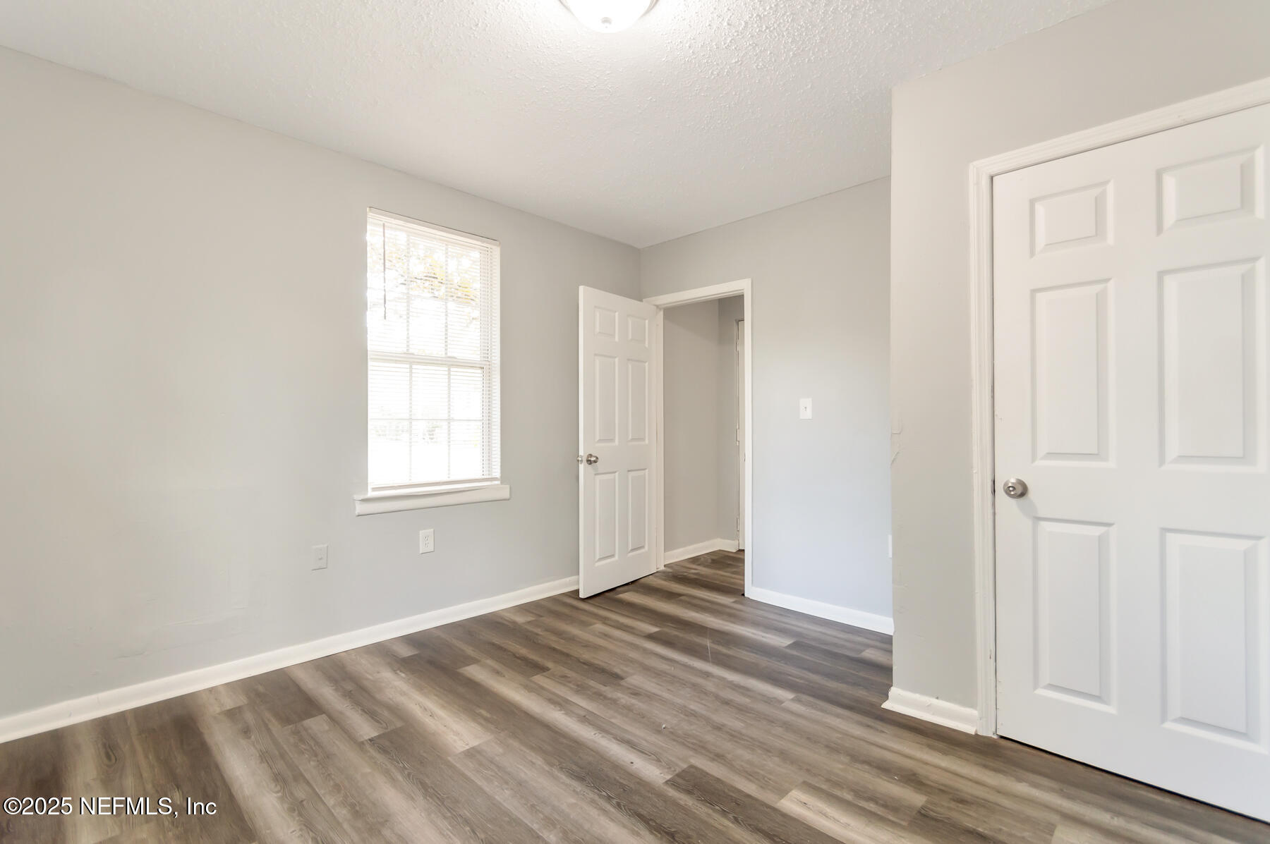 1165 Hart Street Jacksonville, FL 32209 - Photo 14 of 22 a view of empty room with wooden floor and fan