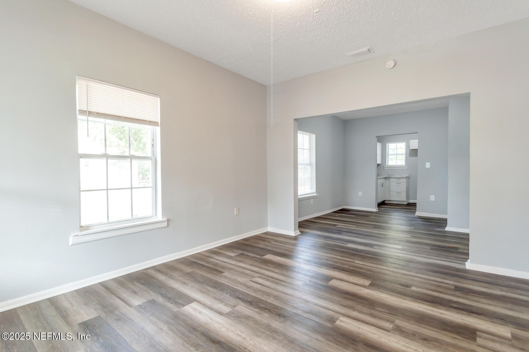 1165 Hart Street Jacksonville, FL 32209 - Photo 2 of 22 a view of empty room with wooden floor and fan
