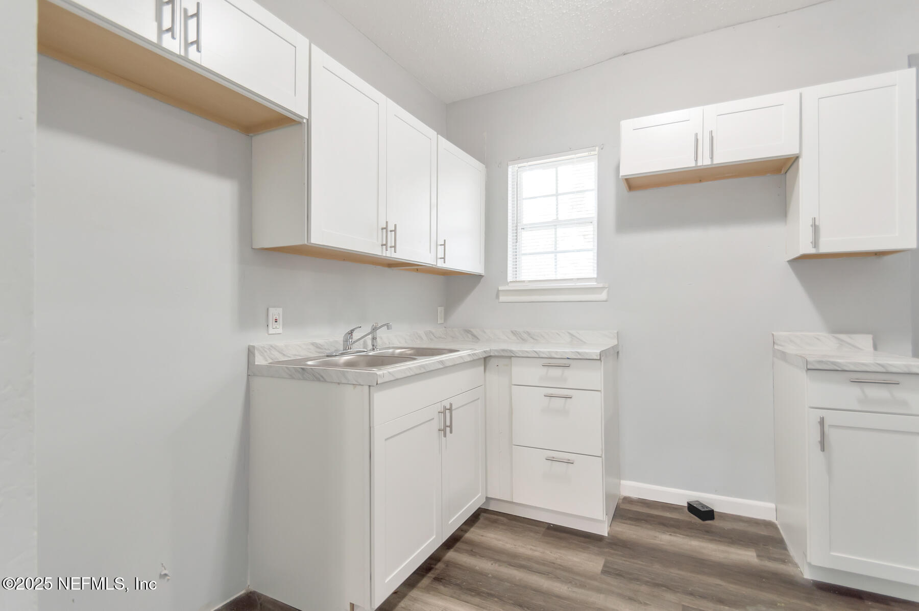 1165 Hart Street Jacksonville, FL 32209 - Photo 6 of 22 a kitchen with stainless steel appliances granite countertop a sink and a stove with white countertops