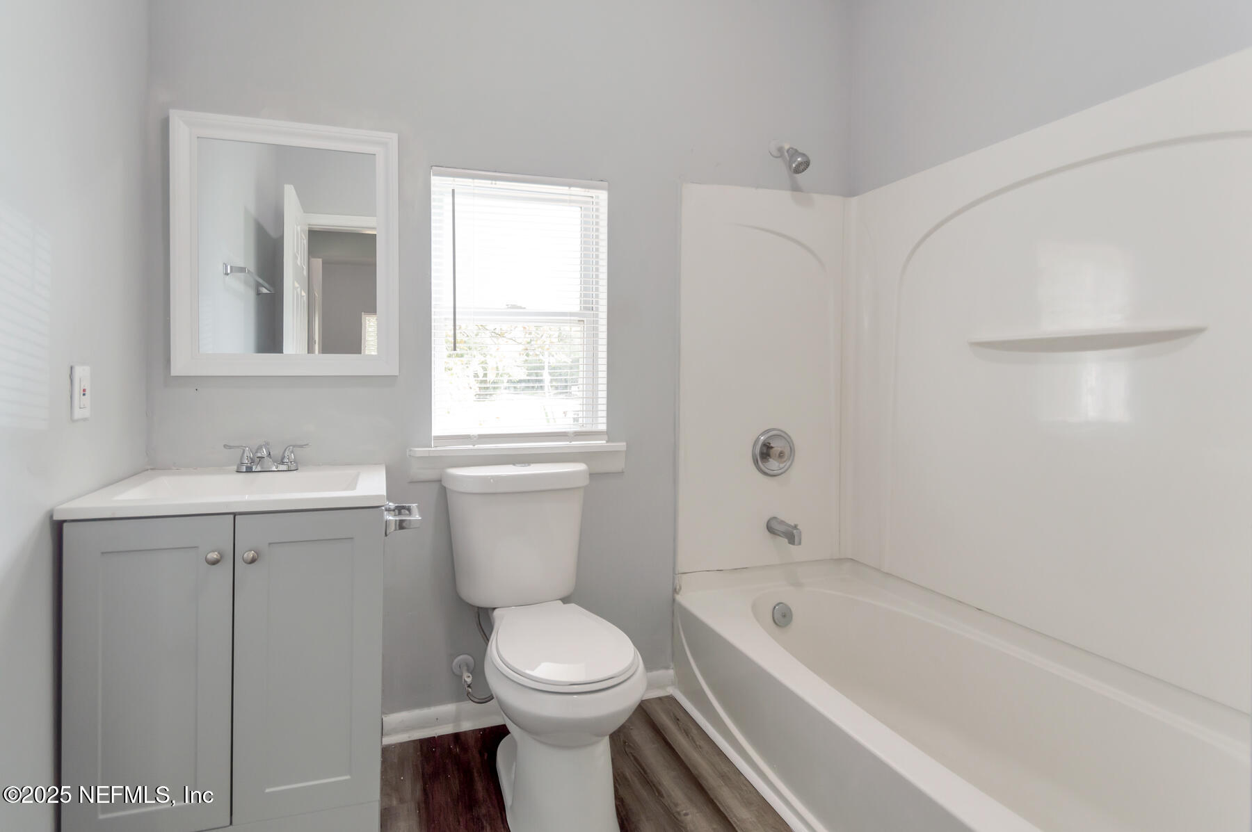 1165 Hart Street Jacksonville, FL 32209 - Photo 8 of 22 a bathroom with a sink a toilet and shower