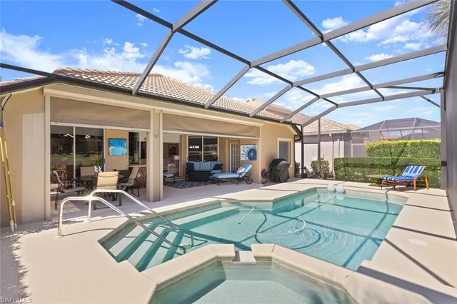 a view of a house with backyard sitting area and porch