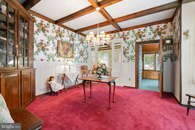 a view of front door with furniture and a window